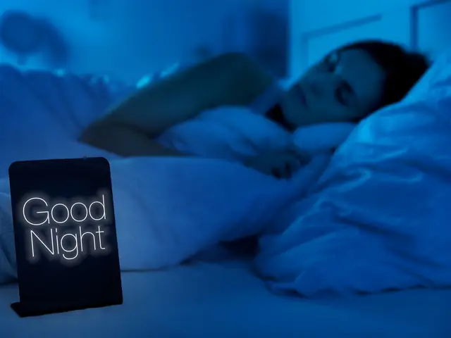 Woman sleeping peacefully in a dark bedroom with a good night sign
